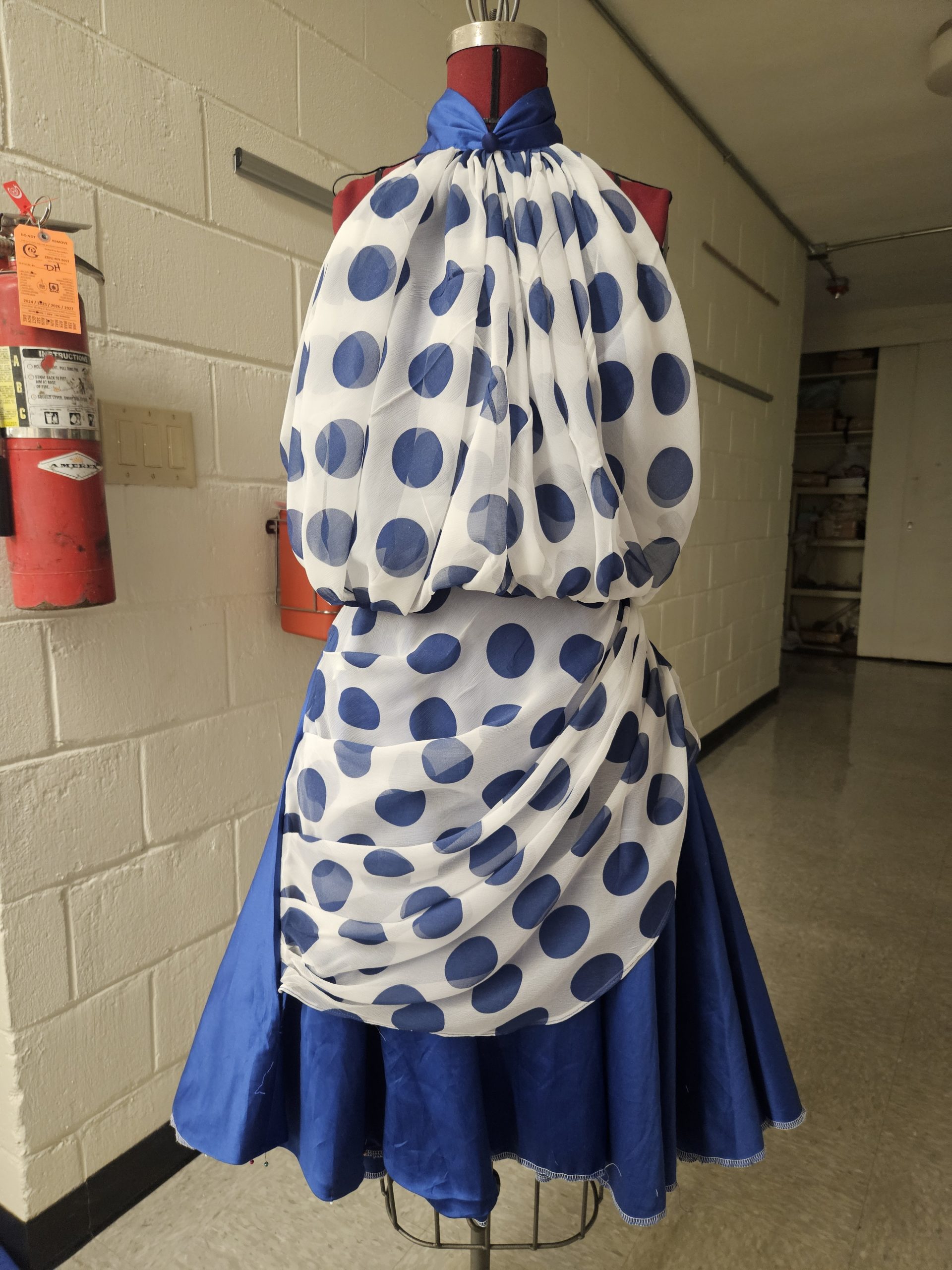 Finished overlay added to dress before hemming.